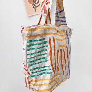Kord-Tragetasche mit bunten abstrakten Linienmuster, lässige Handtasche für den Pendelverkehr.