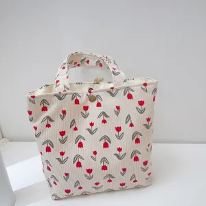 Commuter corduroy handbag with tulip floral print, casual tote bag for students and work.