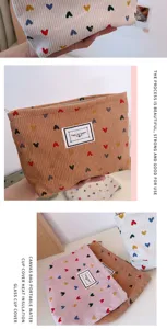 Corduroy cosmetic bag with cute heart patterns, portable zipper storage pouch for daily use items.
