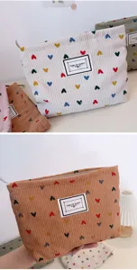 Corduroy cosmetic bag with colorful heart pattern and zipper closure for daily storage.
