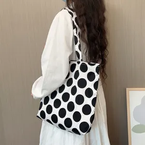 Large capacity polka dot canvas shoulder bag for women, casual adjustable crossbody tote.