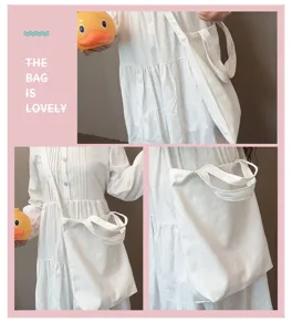 Minimalist white canvas tote bag, versatile shoulder and crossbody bag for daily student commuting.