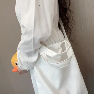 White canvas tote bag minimalist casual shoulder bag for daily commuting and student use.