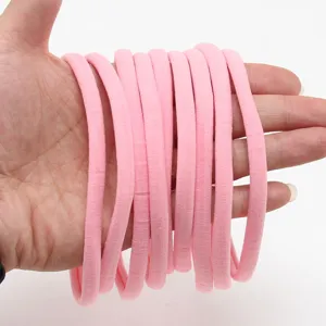 Soft pink nylon elastic baby headbands, stretchy hair bands for DIY kids hair accessories.