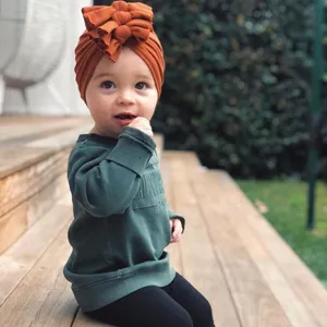 Adorable baby infant turban hat featuring a stylish bow knot design for little toddlers.