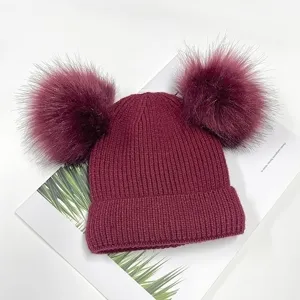 Burgundy double pom-pom knit beanie hat winter warm fleece-lined cute hat detail view