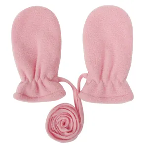 Detailed view of soft pink fleece baby winter mittens with anti-lost hanging neck cord.