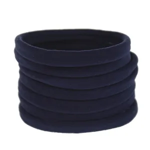 Detail of dark blue elastic nylon hair bands, soft stretchy baby headwear accessories.