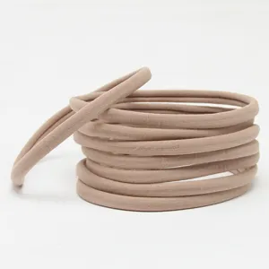 Detailed view of nude elastic nylon hair bands for baby DIY headwear and soft hair accessories.