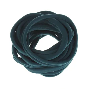 Dark green elastic nylon hair band detail shot, soft stretchy fabric headband accessory.