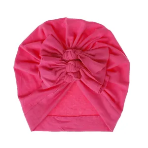 Soft knitted baby turban hat with cute triple bow knot design for infants and toddlers daily wear.
