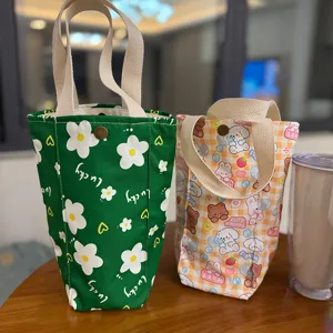 Portable canvas cup sleeve and cute cartoon printed tote bag set for daily outdoor use.