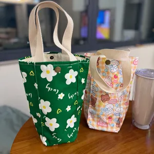 Portable canvas tote bag cute cartoon cup sleeve multi-functional mini handbag for daily use.