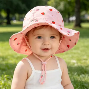 Cute baby pink strawberry bucket hat with chin strap, soft sun protection hat for infants.