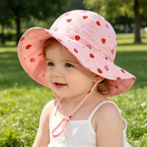 Cute baby sun hat with strawberry print, breathable pink bucket hat for toddler outdoor wear.