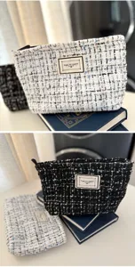 Detailed shot of tweed cosmetic makeup bag with zipper closure and custom fabric label.