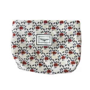 Portable corduroy cosmetic bag with cute floral print zipper travel storage pouch.