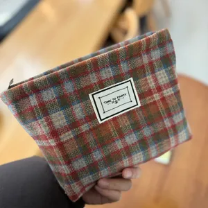 Plaid woolen cosmetic bag, stylish vintage makeup pouch and portable toiletry storage bag.