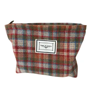 Classic plaid woolen cosmetic bag for women, autumn winter makeup pouch and stylish storage bag.