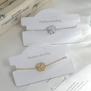 Elegant rotating four leaf clover cubic zirconia bracelet, luxury style adjustable jewelry.