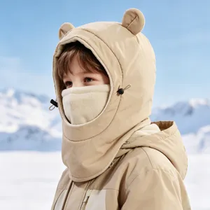 Detailed closeup view of kids winter fleece bear ear hood with integrated mask in snow scene.
