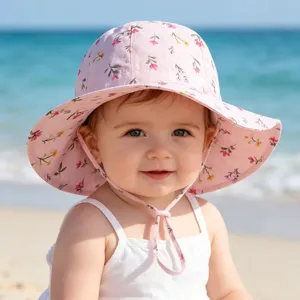 Cute baby sun hat with floral print and chin strap, perfect for outdoor summer beach use.