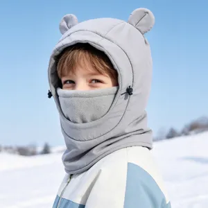 Detail shot of kids winter warm hooded hat with cute bear ears and fleece neck warmer.