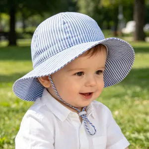 Outdoor baby sun bucket hat with adjustable chin strap, cute blue and white striped design detail.