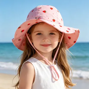 Cute baby sun hat with strawberry print, perfect uv protection for toddler girls outdoors.