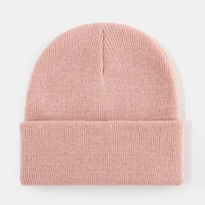 Pink knitted beanie detail shot, cozy ribbed winter hat texture closeup, casual fashion wear.