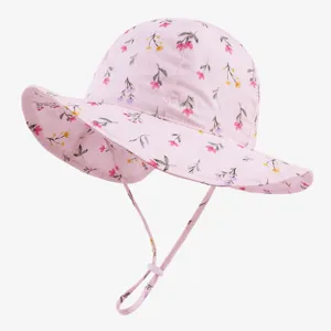 Detailed view of cute pink floral baby sun bucket hat with adjustable chin strap for infants.
