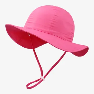 Pink kids sun hat detail, adjustable chin strap, wide brim bucket hat for summer days.