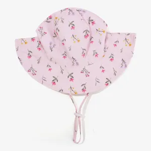 Pink floral baby sun hat with chin strap and adjustable toggle for infant outdoor use