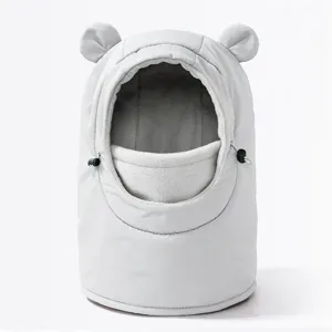 Close-up detail view of children warm windproof winter hat with cute bear ears.