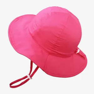 Detail view of the pink kids sun hat showing adjustable cord and breathable fabric design.