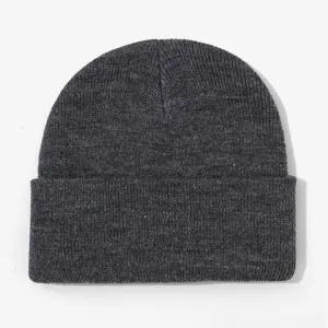 Close-up detail of the dark grey knitted beanie showing fine textured fabric and warm winter cuff.