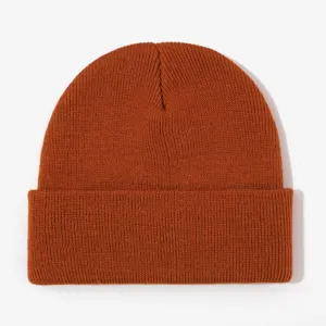 Orange knit beanie detail view, warm autumn and winter pullover hat for casual outdoor wear.
