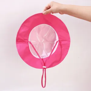Close-up detail shot of pink kids bucket hat interior, showing adjustable chin strap.