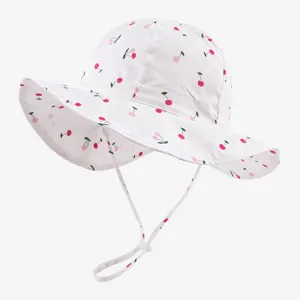 Cute baby bucket hat with sweet cherry print, wide brim sun protection for summer children.