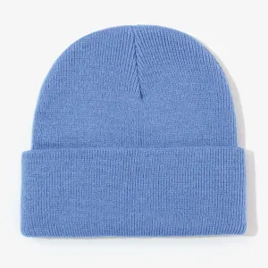 Blue knitted beanie detail, showing soft texture and classic cuffed design for winter warmth.