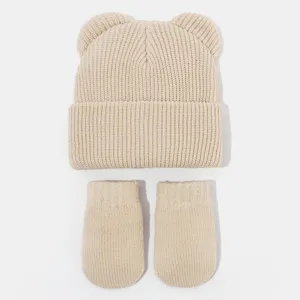 Niedliches Kinder Winter Strickmütze und Handschuhe Set mit süßen Bärenohren Design in Beige.