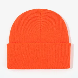 Orange knitted beanie detail shot, soft warm winter cap texture, close up view display.