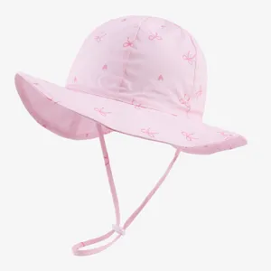 Pink baby sun hat detail, toddler bucket hat with chin strap, cute bow and heart print.