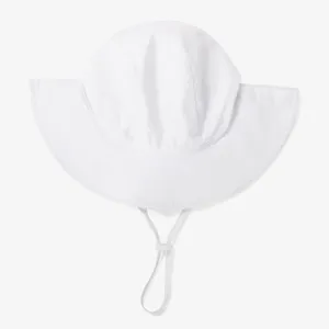 Children sun protection bucket hat detail, wide brim and adjustable chin strap design.