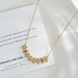 Close-up detail of the elegant gold-plated necklace with colorful marquise zircon stones.