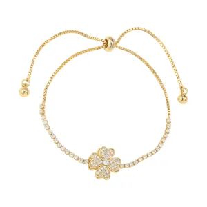 Gold-plated four-leaf clover slider bracelet with sparkling cubic zirconia, adjustable fit.