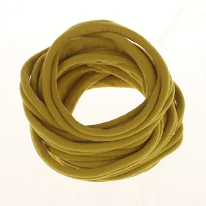 Yellow nylon headband material roll, soft elastic DIY hair accessories detail view.