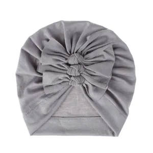 Grey baby turban hat detail showing soft knitted fabric and triple cute bow knots design.