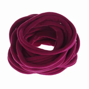 Detailed view of elastic nylon hair band in dark pink, soft texture for DIY baby headbands.