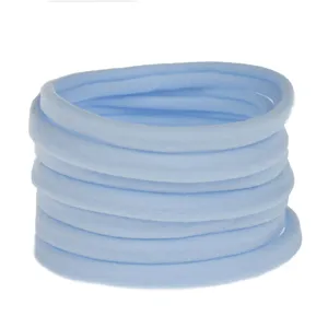 Close up of light blue stretchy nylon baby hair bands detail, soft elastic DIY hair accessories.